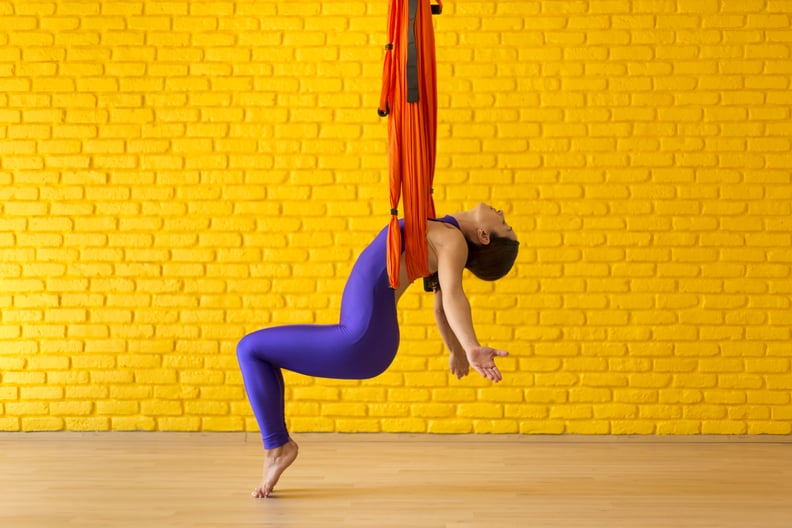 Young Woman doing Antigravity Yoga