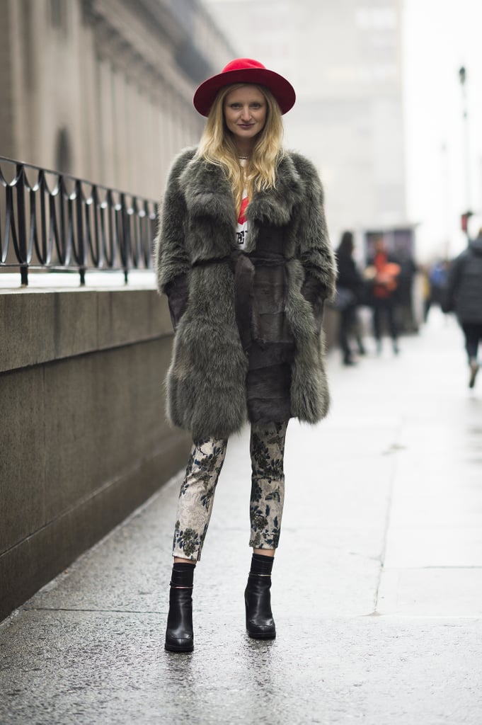 A begging-to-be-touched fur in a subtle gray hue added luxe to printed pants and a fedora.