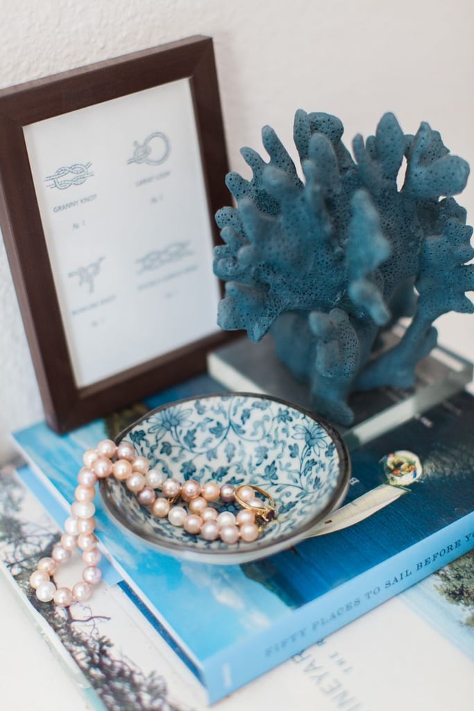 In order to remember her undersea home, the mermaid princess might choose nautical accessories. 
Source: Ever and Anon Photography for The Everygirl