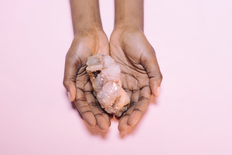 woman holding a crystal as an energy healing tool