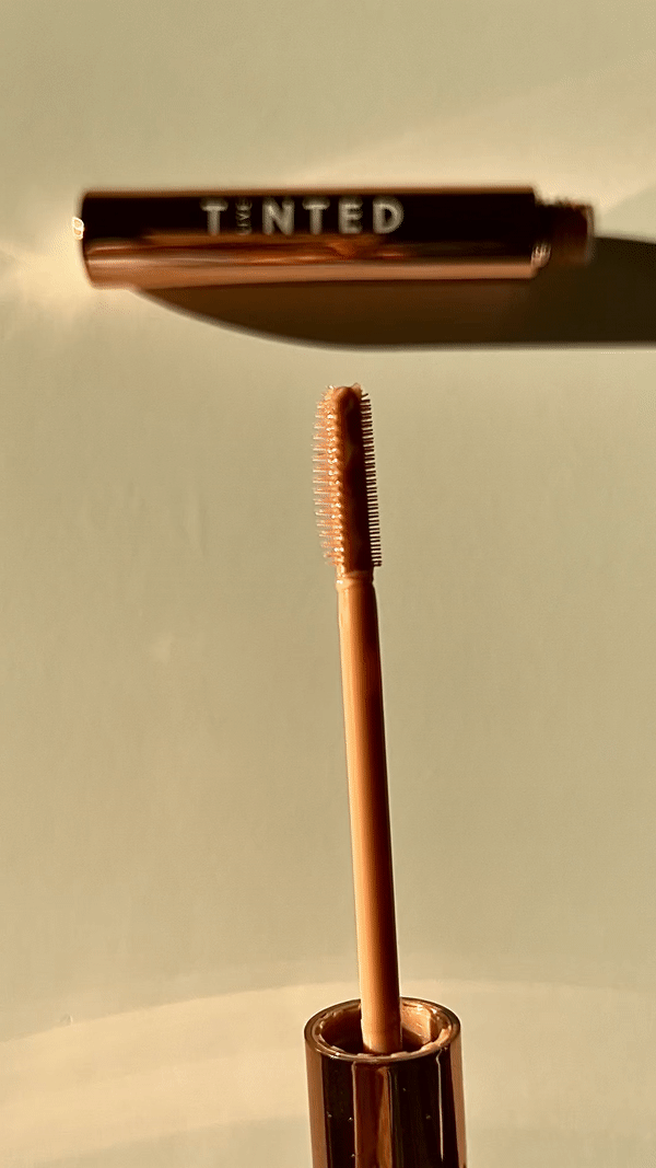 Gif of Huebrow's applicator wand showing the three sides, including long flexible bristles, shorter densely packed bristles, and the two flat sides.