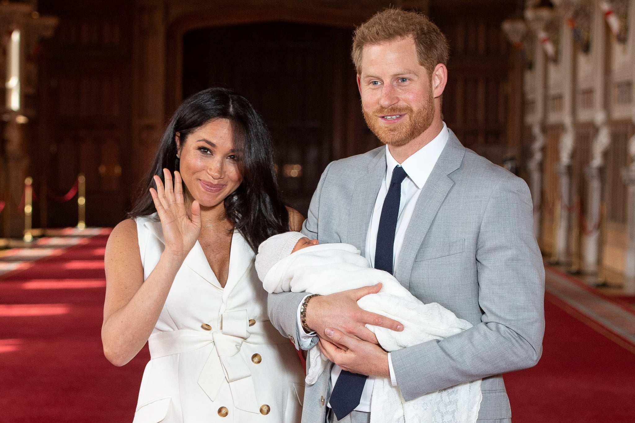 Britain's Prince Harry, Duke of Sussex (R), and his wife Meghan, Duchess of Sussex, pose for a photo with their newborn baby son in St George's Hall at Windsor Castle in Windsor, west of London on May 8, 2019. (Photo by Dominic Lipinski / POOL / AFP)        (Photo credit should read DOMINIC LIPINSKI/AFP/Getty Images)
