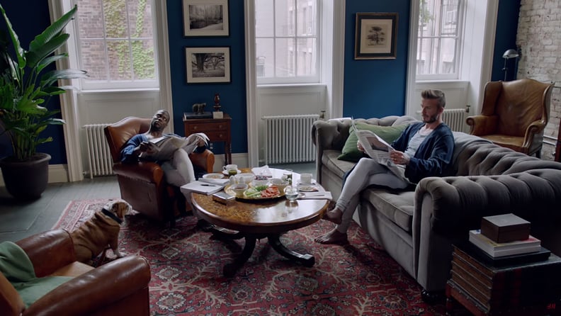 The firehouse sitting room features blue walls and a tufted couch.