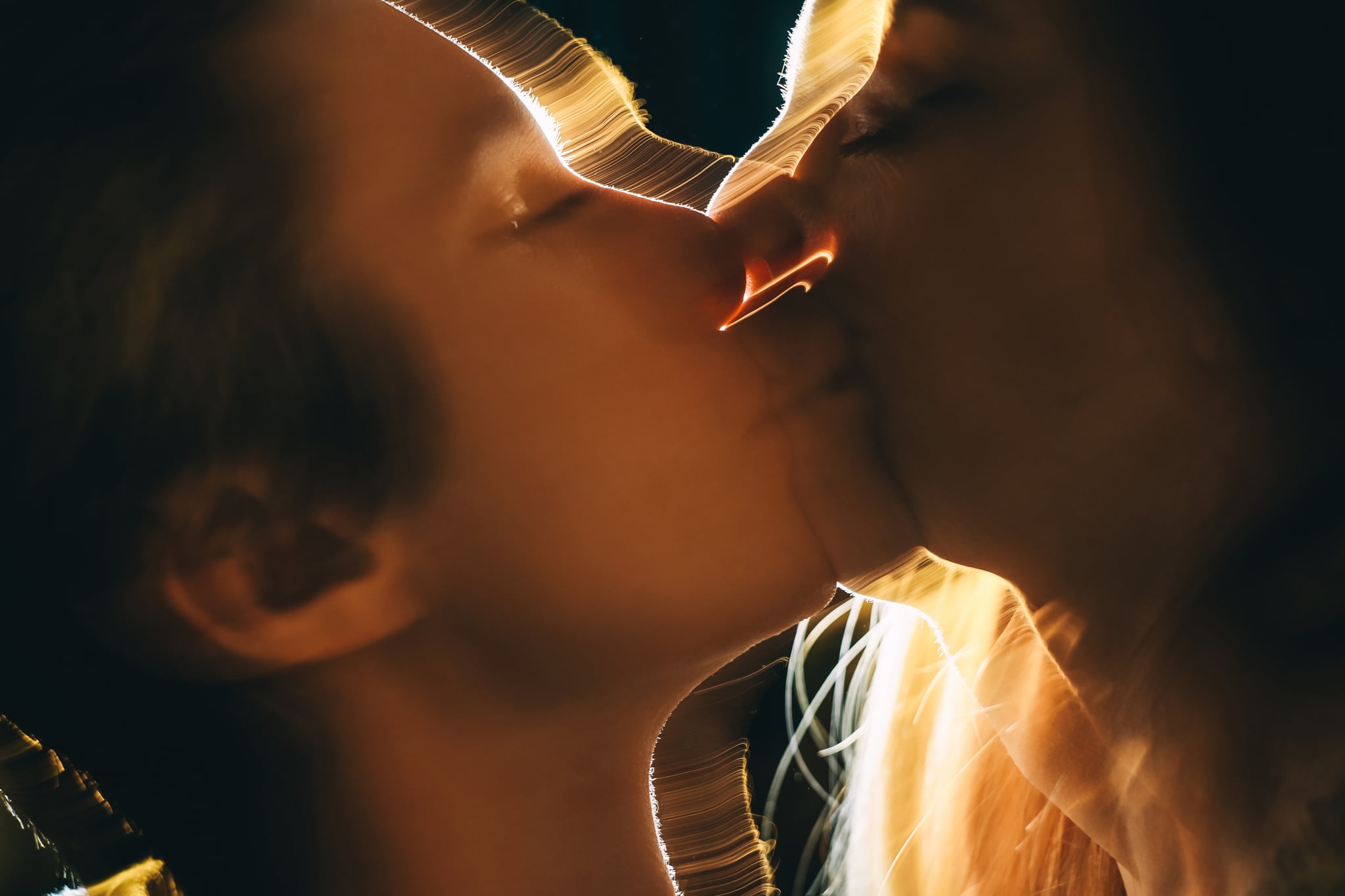 Blurry photo of a couple passionately kissing