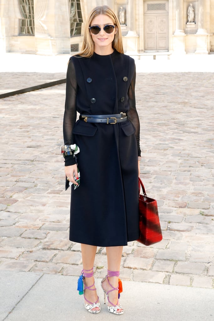 Hack: Create the illusion of a jacket by layering a sleeveless trench over mesh sleeves and wrapping a leather belt around your waist.