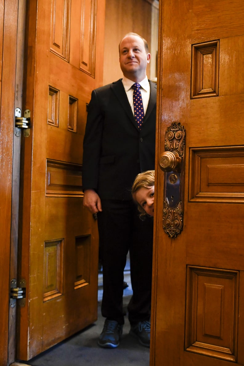 DENVER, CO - JANUARY 8: Governor-elect Jared Polis stands in his office as his daughter, Cora, pokes her head out,  before his inauguration at the Colorado State Capitol on Tuesday, January 8, 2019. (Photo by AAron Ontiveroz/The Denver Post via Getty Imag