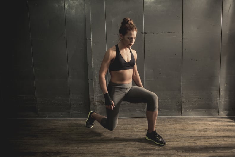 An athletic woman doing lunges (stock image).
