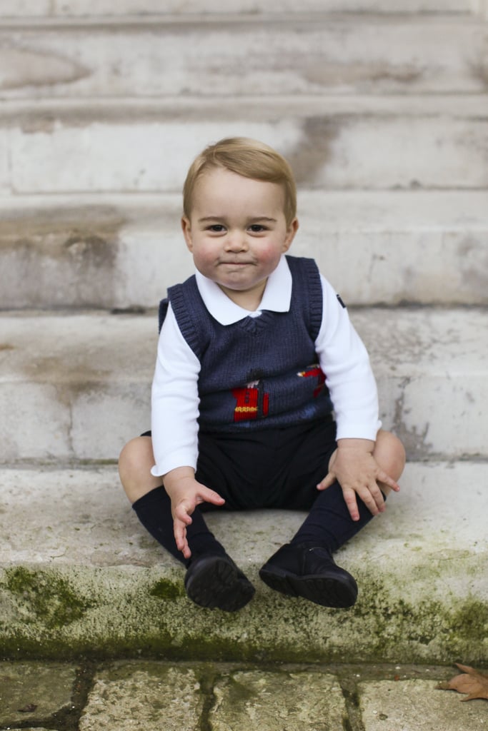 The royal, who was just shy of 17 months old, sat on the steps in a courtyard at Kensington Palace for the festive photos.