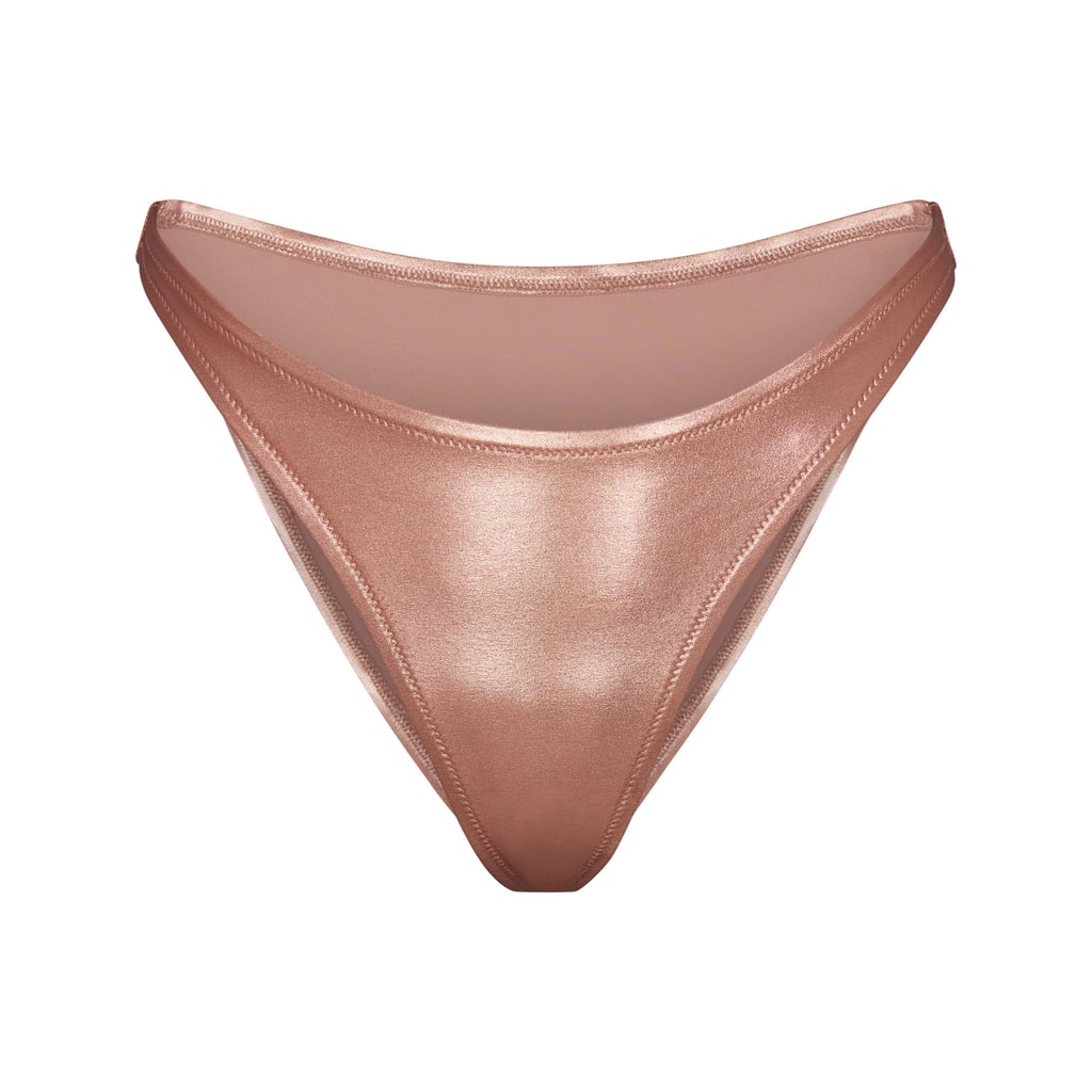 Skims Metallic Swim Dipped Mid-Waist Bottoms in Champagne ($48)