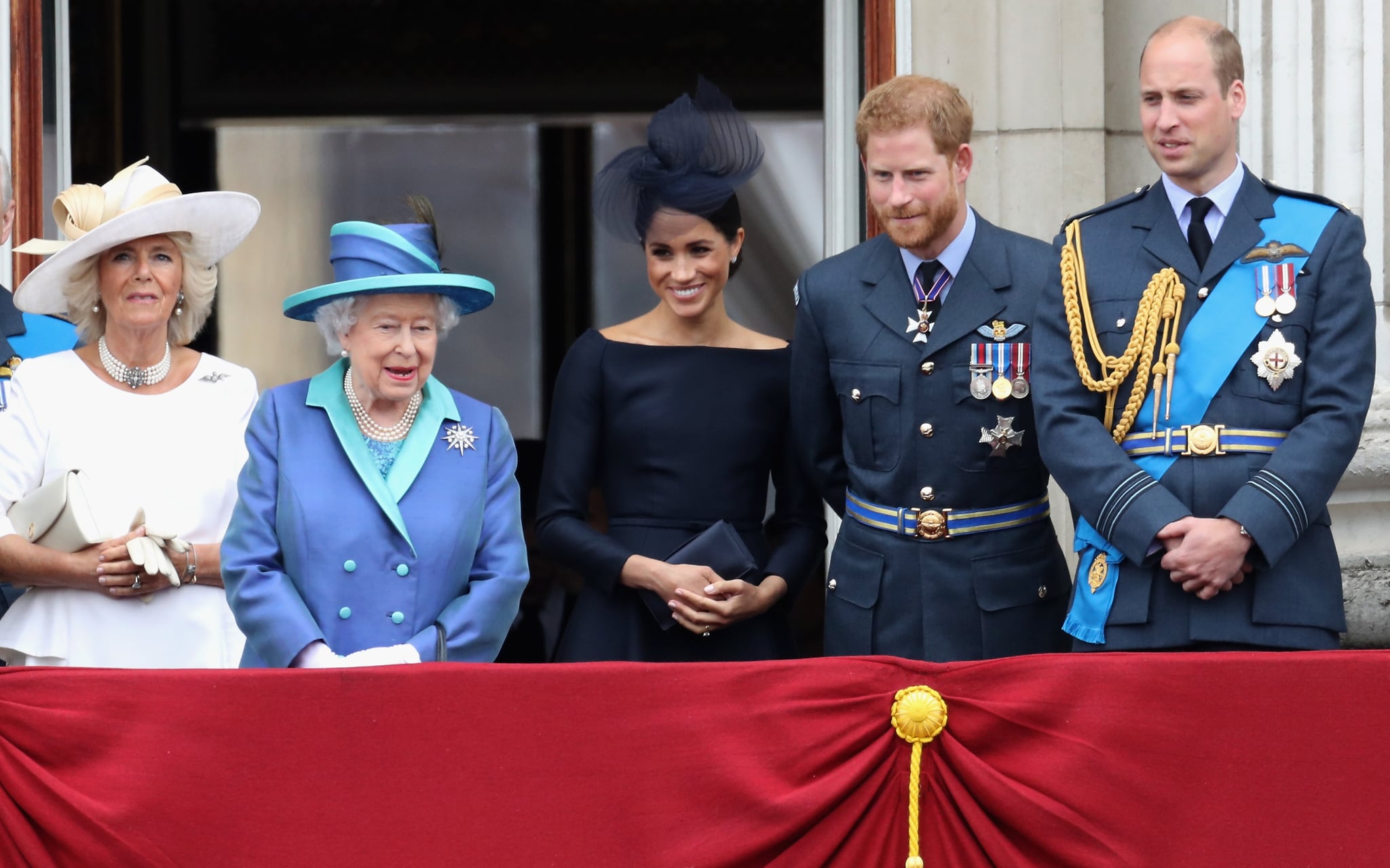LONDON, ENGLAND - JULY 10:  (L-R) Prince Charles, Prince of Wales, Prince Andrew, Duke of York, Camilla, Duchess of Cornwall, Queen Elizabeth II, Meghan, Duchess of Sussex, Prince Harry, Duke of Sussex, Prince William, Duke of Cambridge and Catherine, Duchess of Cambridge watch the RAF flypast on the balcony of Buckingham Palace, as members of the Royal Family attend events to mark the centenary of the RAF on July 10, 2018 in London, England.  (Photo by Chris Jackson/Getty Images)