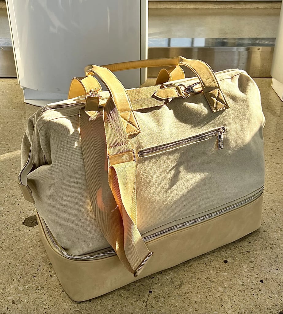 Béis The Weekender Travel Bag ($76, originally $108)
Whether you're gearing up for an international trek or a quick weekend away, this cult-favorite Béis bag can accompany you on any jet-setting adventure. Its thoughtful design maximizes on available space with deep interior pockets and a bottom compartment that can hold everything from shoes to a laptop. Béis products are rarely on sale, which makes the brand's Cyber Monday event that much more exciting. To learn more, check out our review of the Béis Weekender Travel Bag.
Editor Quote: "It's ideal for a quick weekend trip on its own, but it's also great as carry-on luggage for a longer trip, whether you're flying or driving. I even used it to store and pack everything I needed for my best friend's wedding. I loved distinct sections for clothes and more delicate items vs. heavier, durable items like shoes, hair tools, and toiletries." — Anvita Reddy, former assistant shopping editor