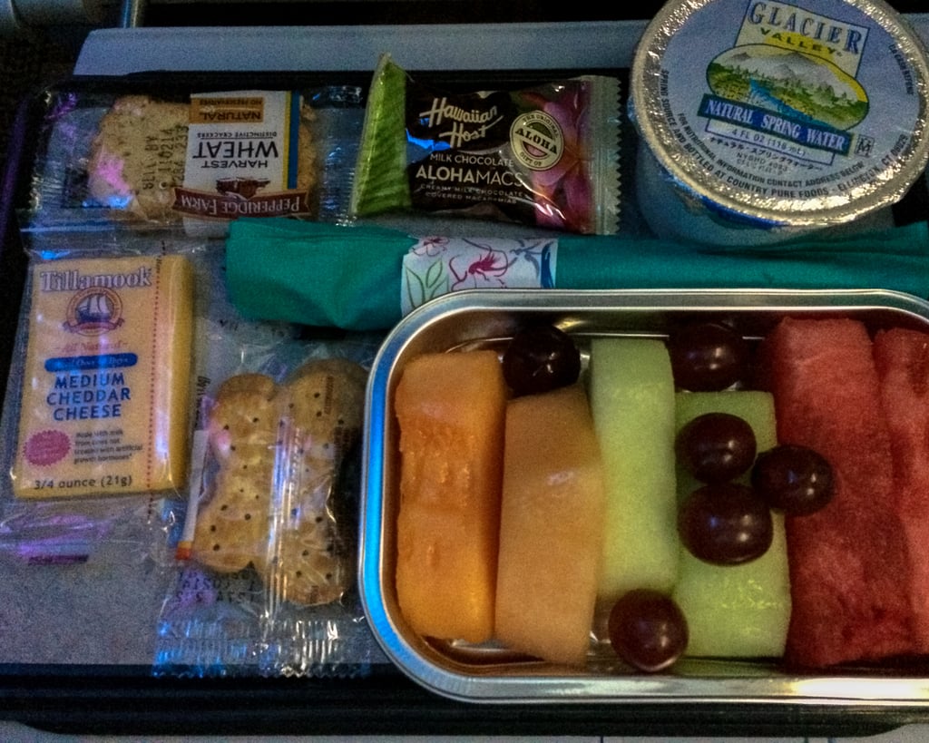 Like most people, I am not a big fan of airplane food. Because, let's face it: even though the aluminum box label states "fresh," how fresh can that food really be, thousands of feet above the ground? 
Yet with Hawaiian Airlines, it's a bit different. It provides island-inspired meals that actually taste good, making it hard not to become overly excited about all the mouthwatering food awaiting you at your arrival. And I must say, the Hawaiian milk chocolate included with the meal is a sweet touch, too.