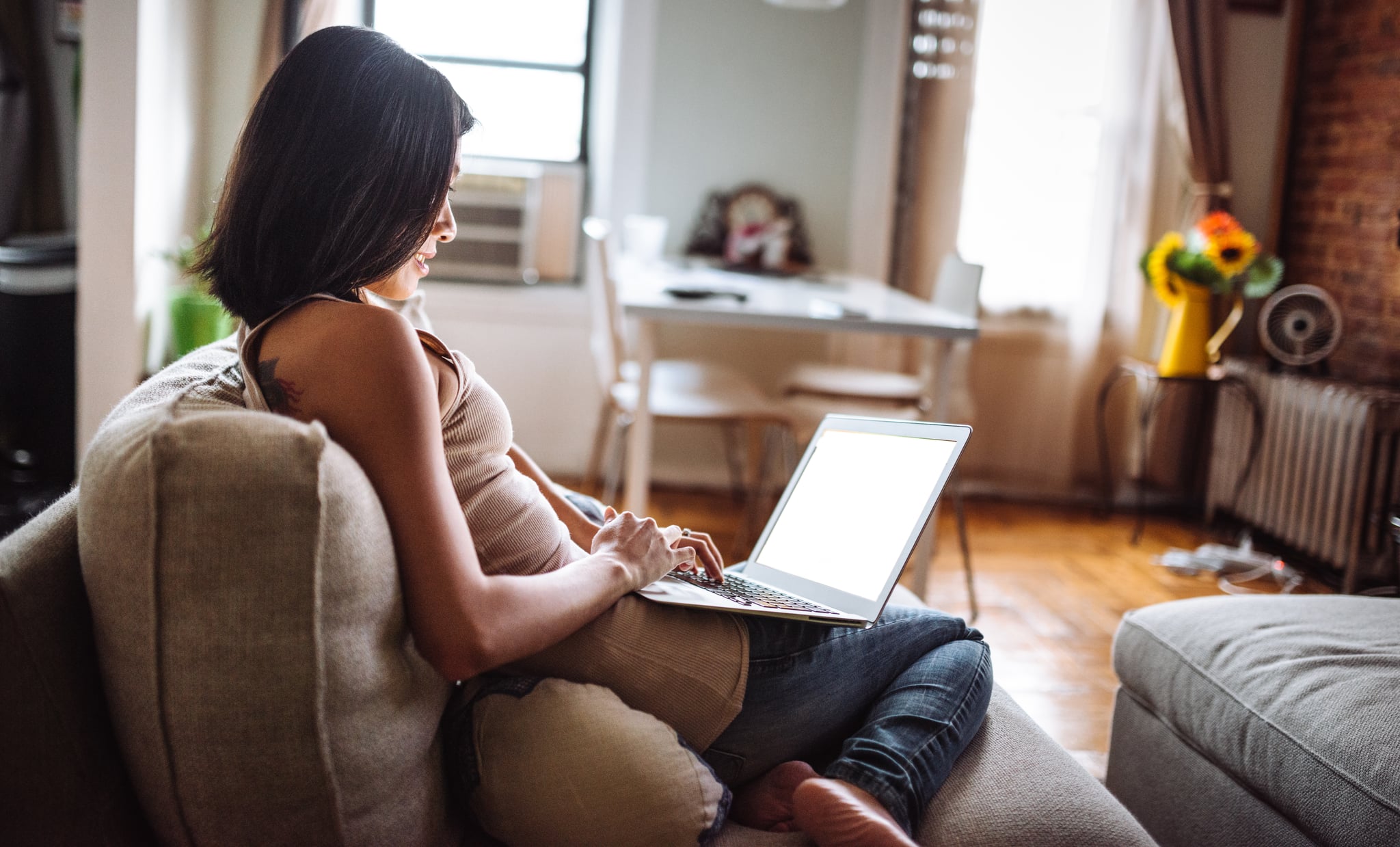 woman looking the tv at home