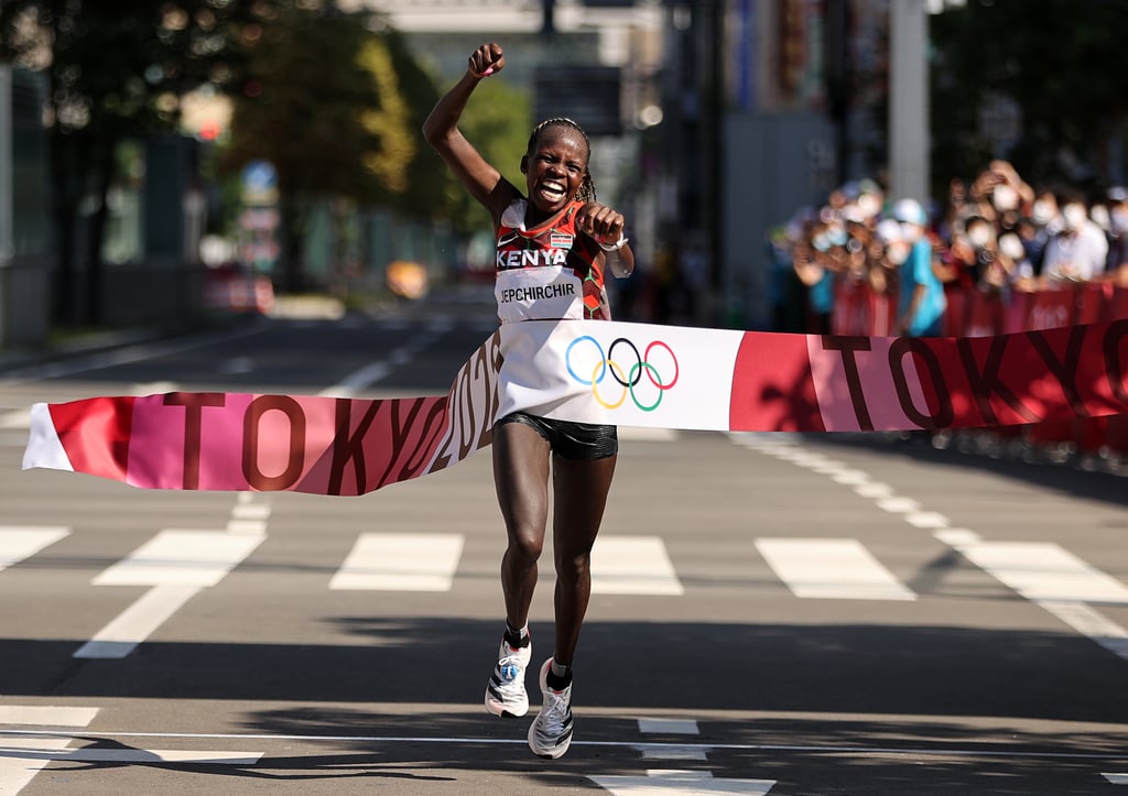 Peres Jepchirchir breaks the tape to win gold in the women's marathon at the 2021 Olympics.