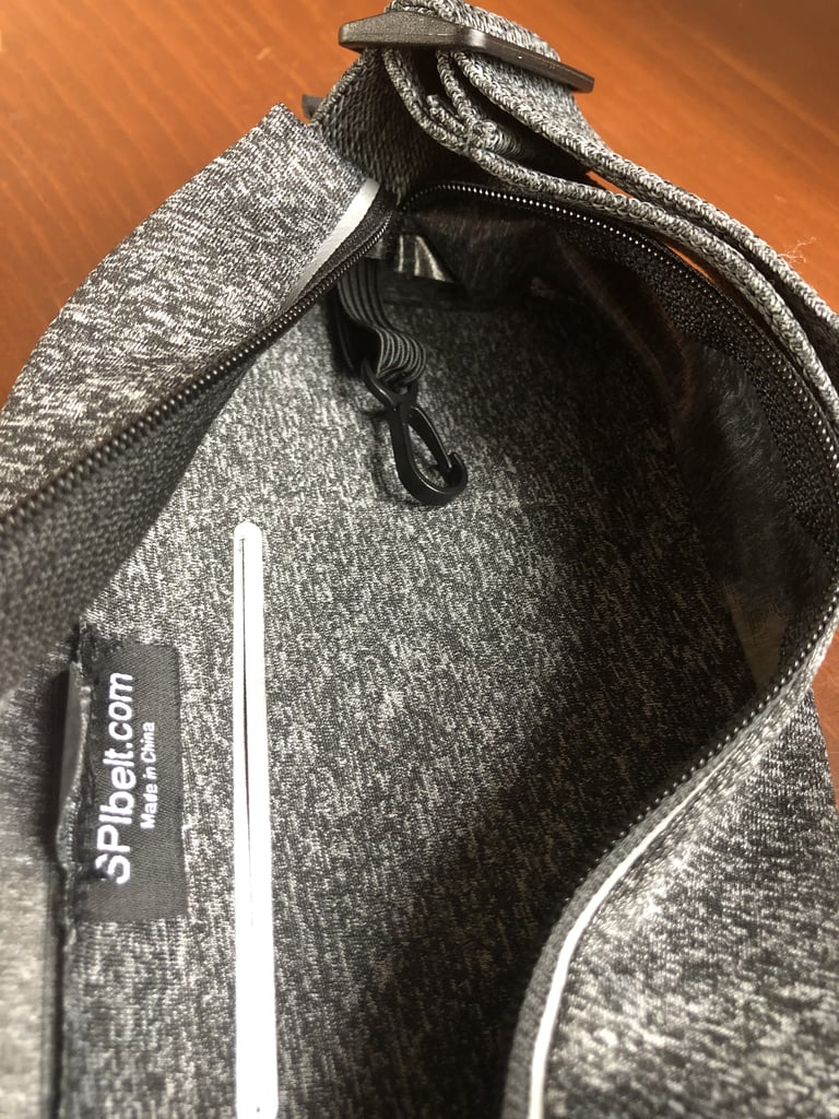 With my phone in the separate front compartment, this other pocket is large enough to hold an extra snack, tissues, or lip balm — perfect for longer runs. There's even a spot for a credit card and a hook for my keys. I always bring a house key so I can lock my front door when I leave.