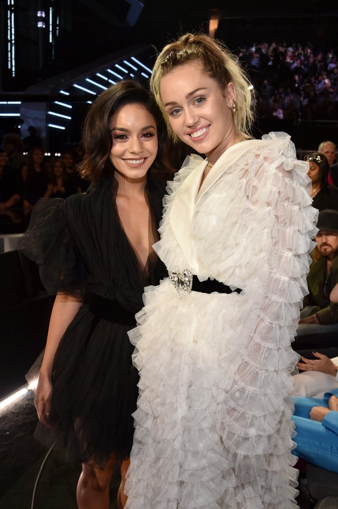 Miley Cyrus and Vanessa Hudgens had a little Disney Channel reunion at the Billboard Music Awards on Sunday. During an ad break, Vanessa took a break from her hosting duties to catch up with her former costar, giving us a heavy dose of nostalgia. While the "Malibu" singer is well-known for her TV series Hannah Montana, she also made a quick cameo in Vanessa's equally popular movie franchise in High School Musical 2 back in the day. Now that Miley is making new music, it sounds like the perfect time for the two to do a collaboration.