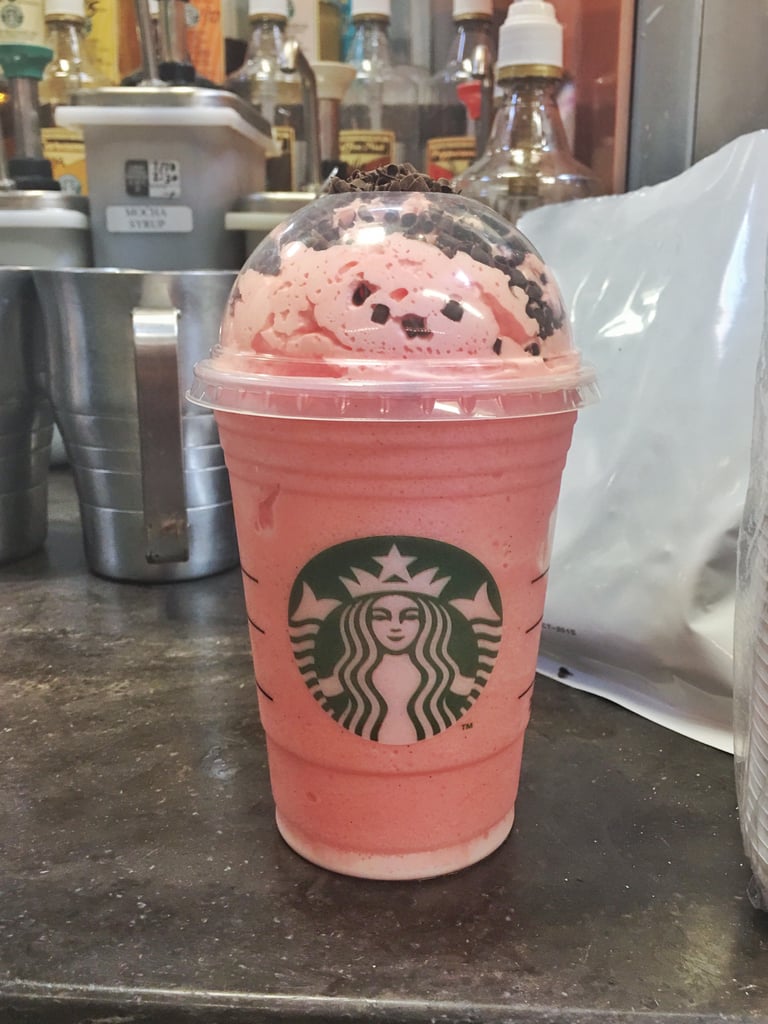 Vanilla Bean Frappuccino with raspberry pumps topped with raspberry-infused whipped cream and chocolate curls.