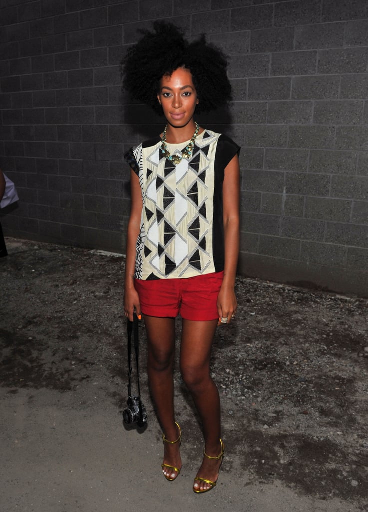 During Spring 2012 NYFW, Solange made her geometric-print tank look fresh and modern by pairing it with tailored red shorts and thin-strap neon sandals. Her chunky beaded necklace was also totally on point.