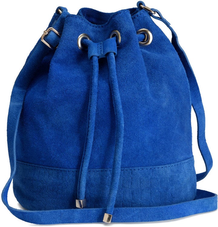 A bucket bag is the ultimate practical accessory; it keeps your must haves safe from harm while you enjoy a day at a music festival or a night on the town.
Suede Bag ($40)