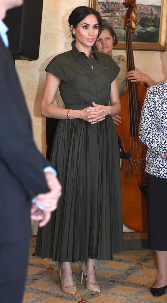 Meghan wore this pleated Brandon Maxwell shirtdress during her 2018 visit to Sydney, styling her look with neutral Tamara Mellon pumps for an afternoon reception at Admiralty House.