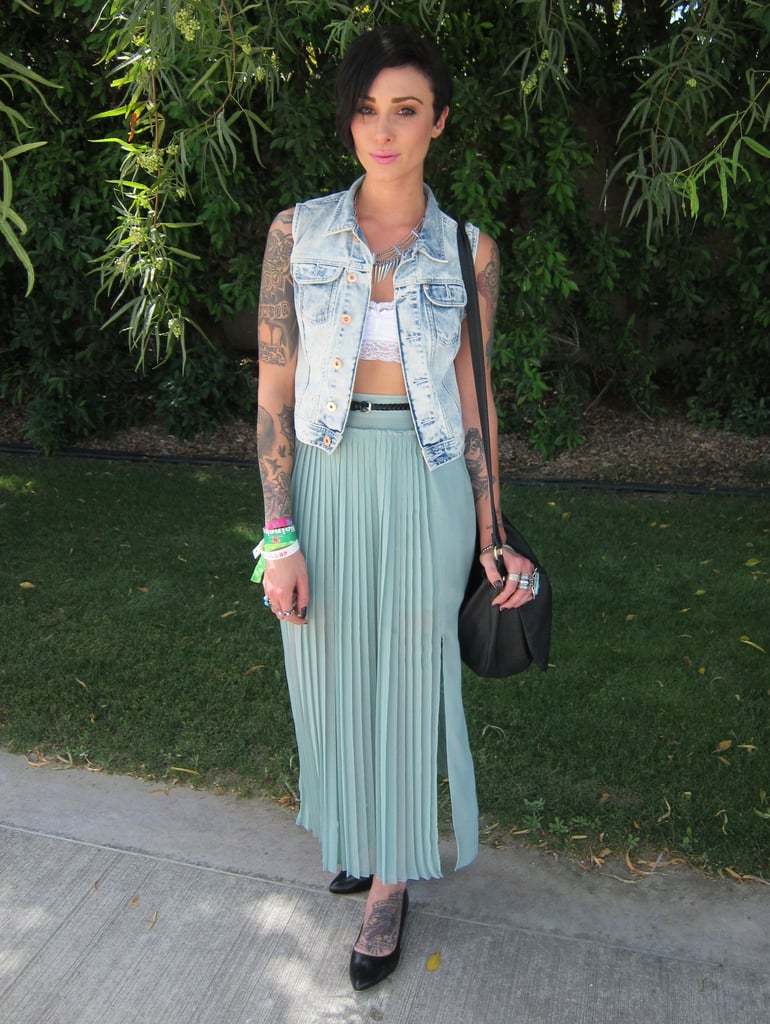Possibly the coolest girl at the H&M Coachella party, decked out in an H&M denim vest, seafoam green maxi skirt, and some pretty awesome tattoos. 
Source: Chi Diem Chau
