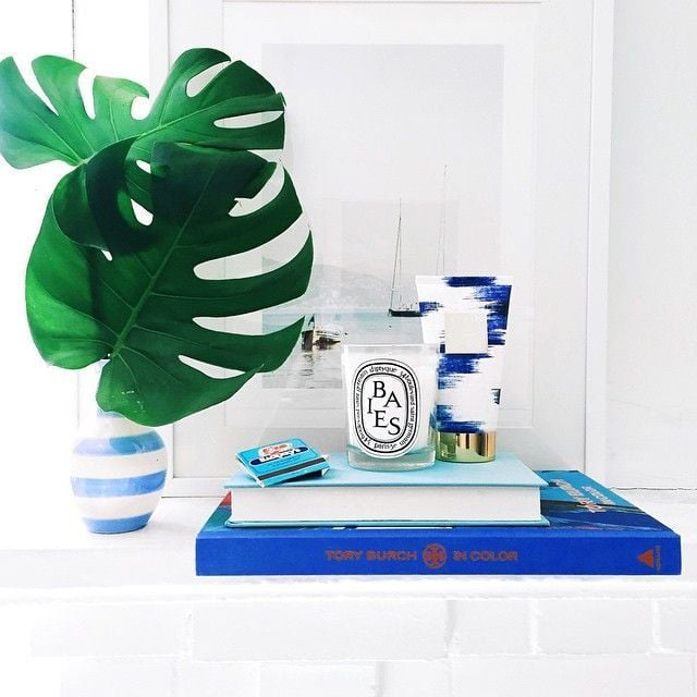 Place a candle on top of stacked books (bonus points for color coordination).
