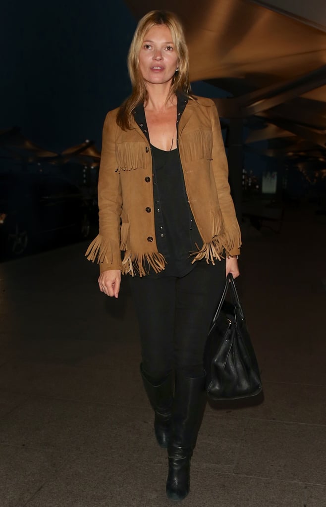 Oh, Kate — always pairing the unexpected. Here she sets the classic piece off with a fringed suede jacket.
Photo courtesy of Saint Laurent