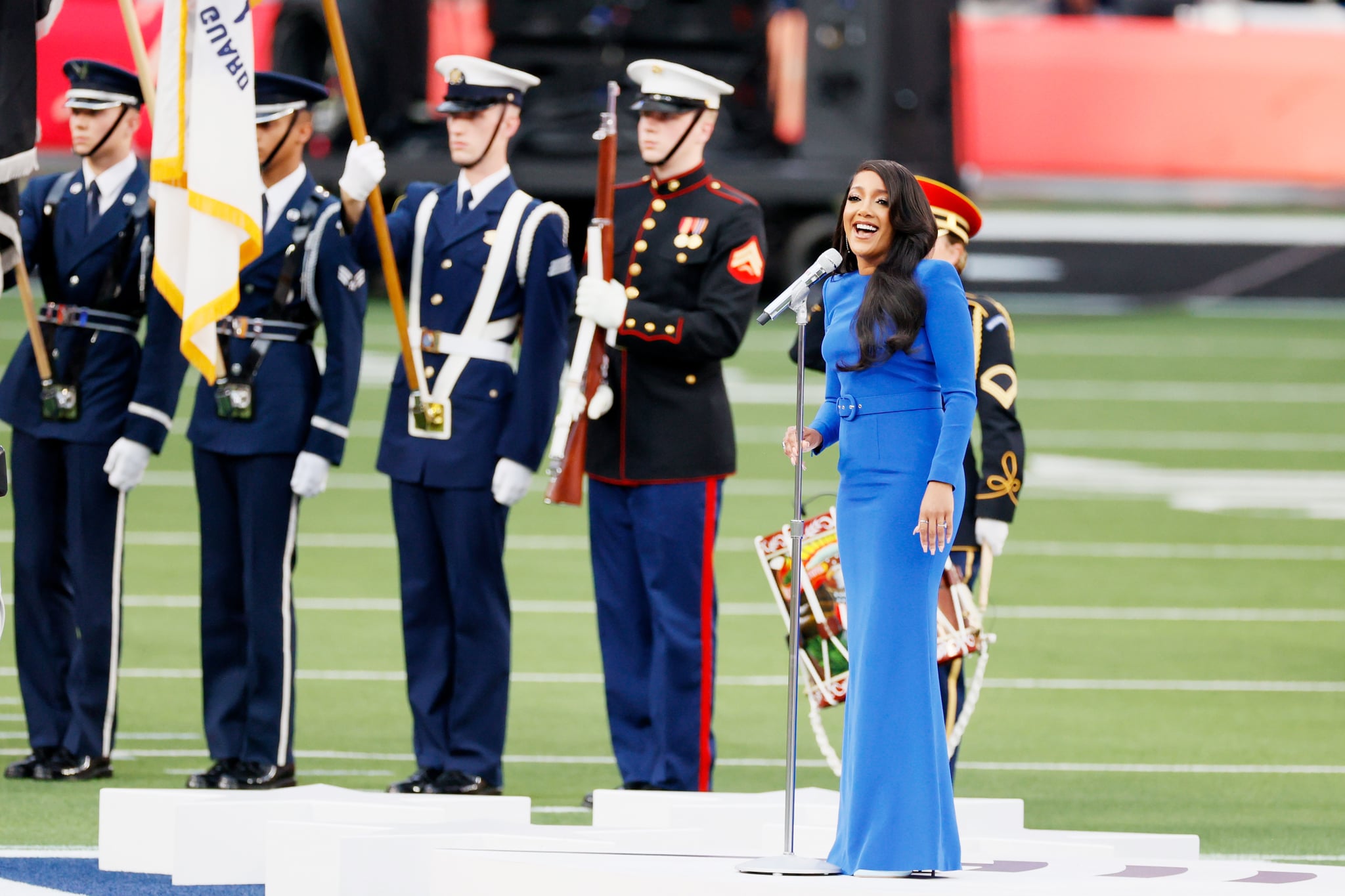 INGLEWOOD, CALIFORNIA - FEBRUARY 13: Singer Mickey Guyton performs the national anthem before Super Bowl LVI between the Cincinnati Bengals and the Los Angeles Rams at SoFi Stadium on February 13, 2022 in Inglewood, California. (Photo by Steph Chambers/Getty Images)