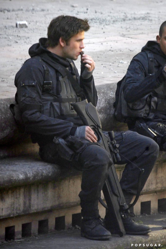 Liam Hemsworth Eating Chocolate on the Mockingjay Set