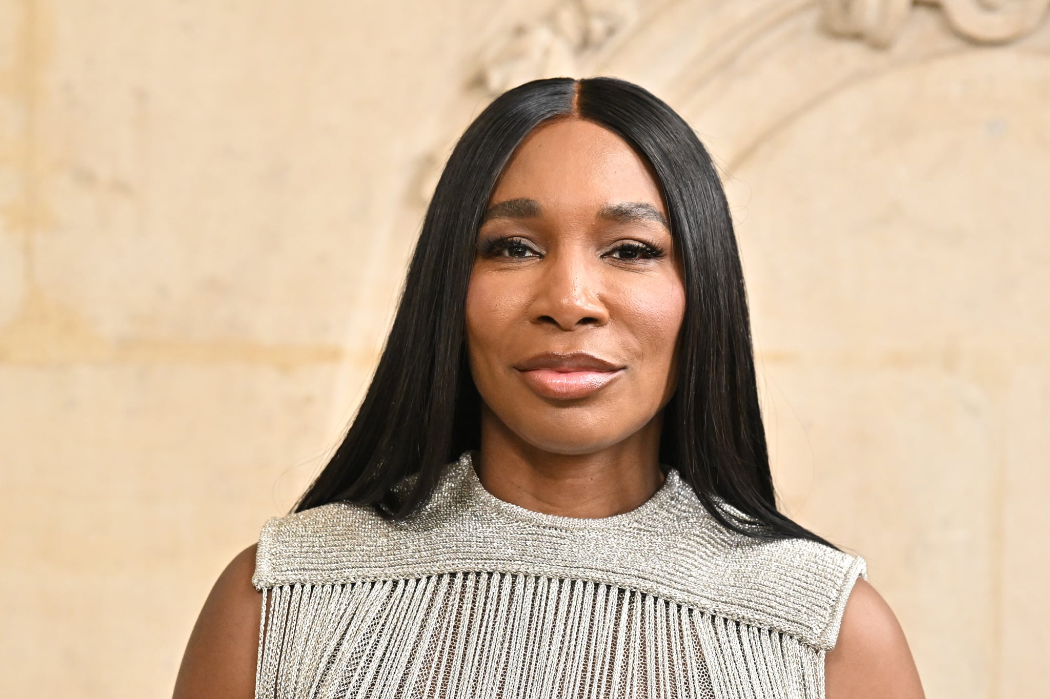 Venus Williams, tennis superstar, in a silver dress at a fashion show in Paris