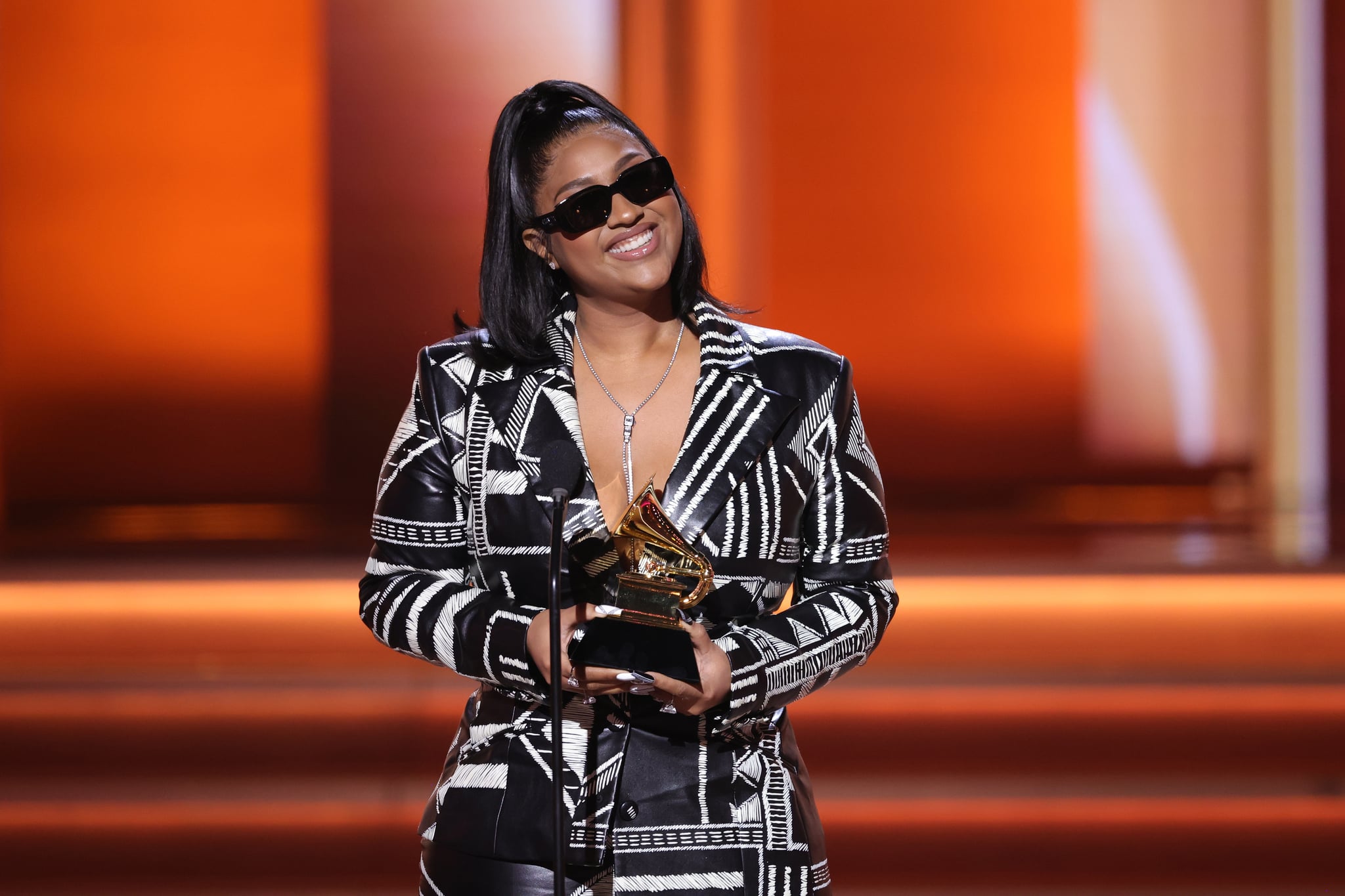 LAS VEGAS, NEVADA - APRIL 03: Jazmine Sullivan accepts the Best R&B Album award for 'Heaux Tales' onstage during the 64th Annual GRAMMY Awards at MGM Grand Garden Arena on April 03, 2022 in Las Vegas, Nevada. (Photo by Rich Fury/Getty Images for The Recording Academy)