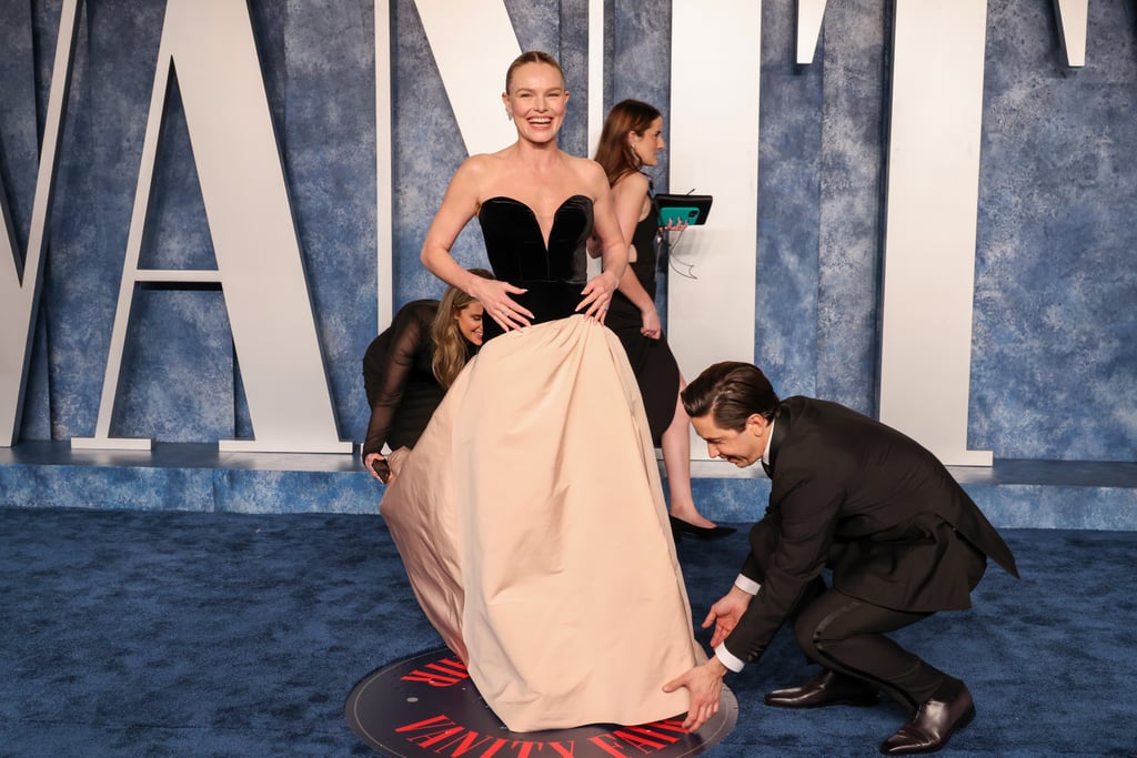 Justin Long Fixes Kate Bosworth's Dress at the Vanity Fair Oscars Party 2023