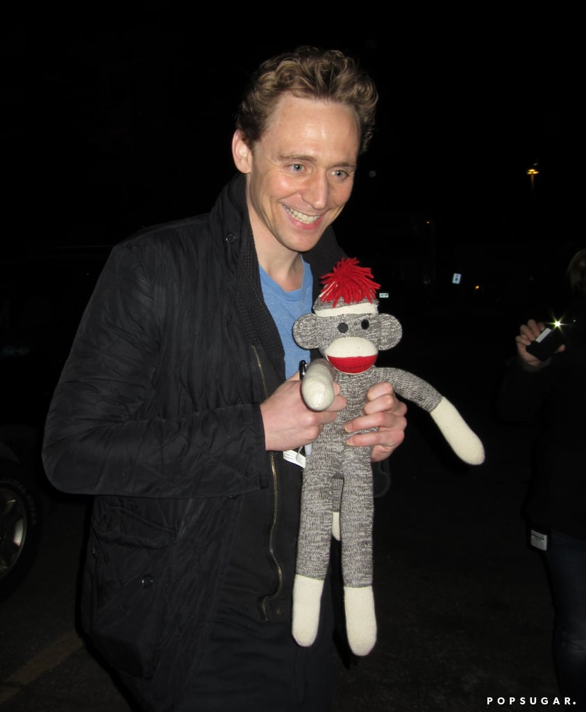 On Thursday, Tom Hiddleston posed with a sock monkey gift he was given by a fan in Toronto.