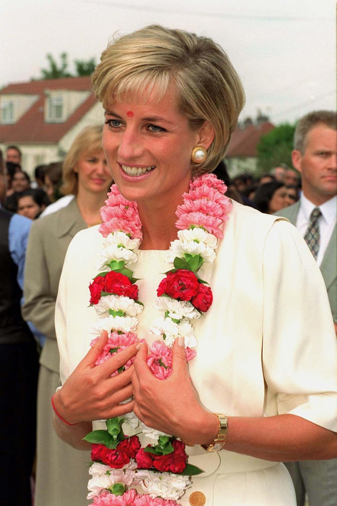 She received a traditional garland when she arrived at the Shri Swaminarayan Mandir Hindu Temple in London in June 1997.