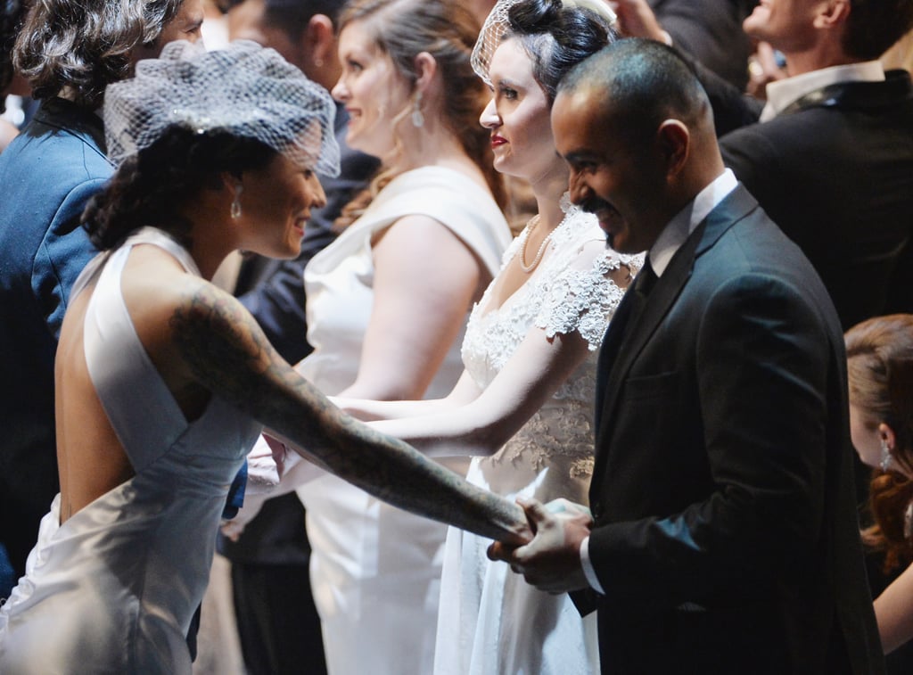 A bride got emotional as she held hands with her groom.