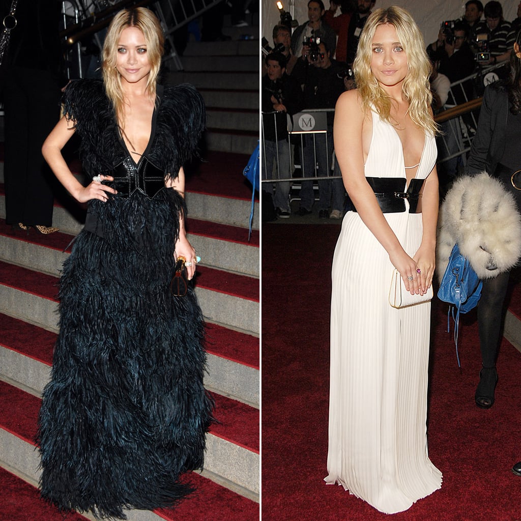 Twinning combo: The stylish sisters had tails wagging in two plunging belted gowns at the 2007 Costume Institute Gala in NYC.

Mary-Kate oozed gothic glamour in a full-feathered creation, sweeping updo, and gold-trim box clutch.
Ashley wore a white pleated gown with a contrasting black leather belt and sleek white clutch.