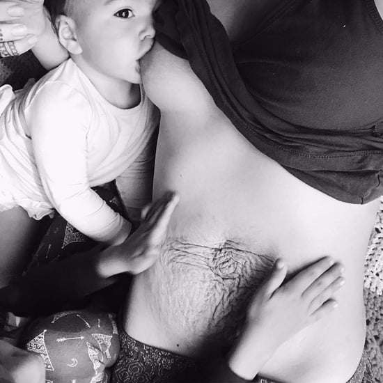 Photo of Mom Breastfeeding With Stretch Marks
