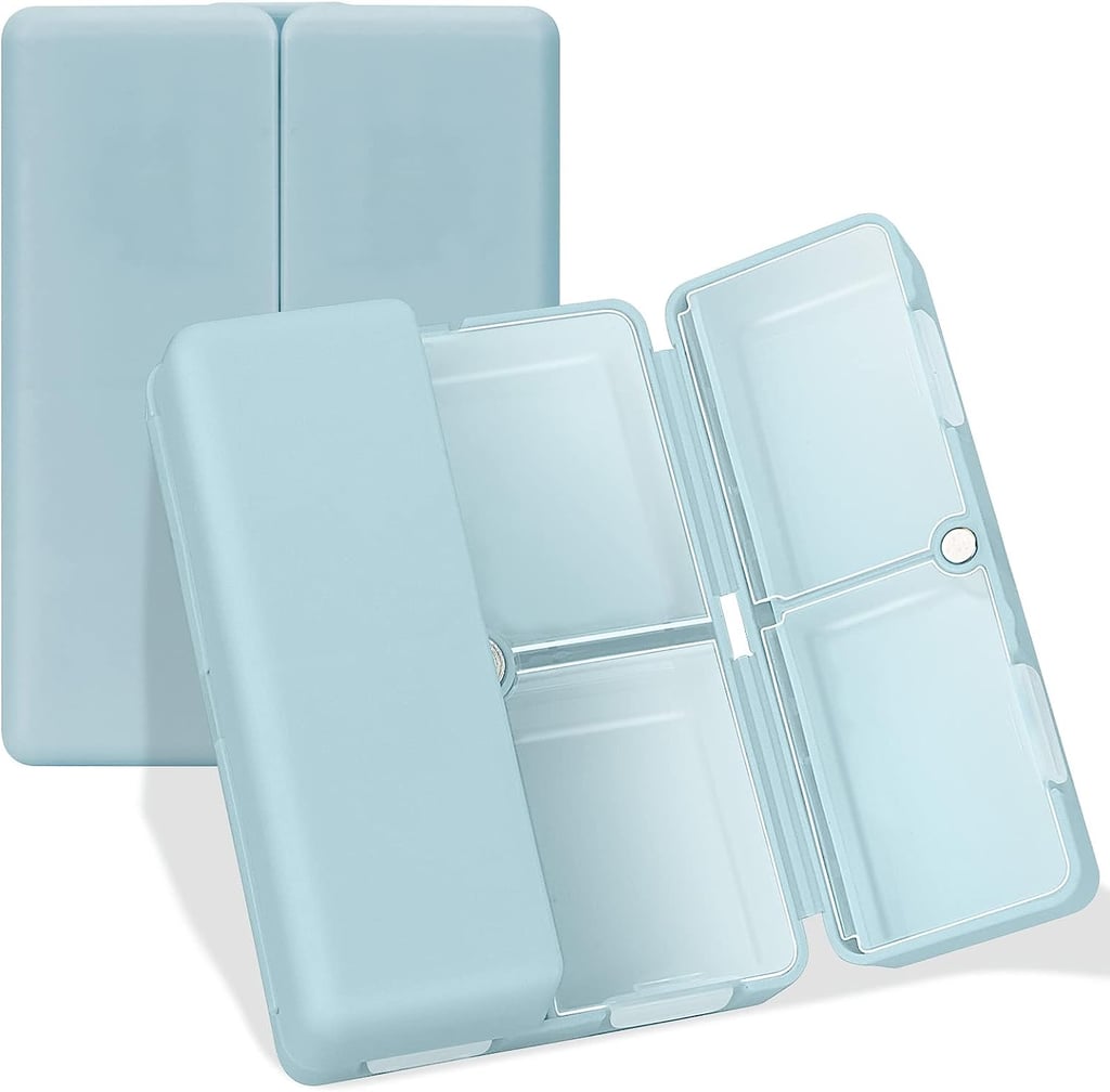 FYY Daily Pill Organizer ($8, originally $10)
Streamline your pill and supplement routine with this clever organizer. Featuring seven compartments (six small and one large), along with a transparent inner lid, it makes it easy to find what you're looking for without having to open each one. 
Expert Quote: "I recently purchased this folding pill box and it's so convenient, saves a ton of space and looks chic." — Kelly Smith, Host of the meditation podcast, Mindful in Minutes, and author of Meditation for the Modern Family
