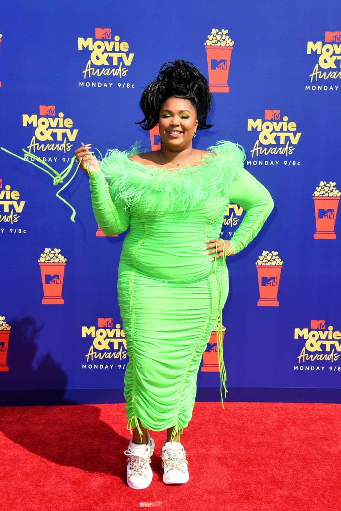None of Lizzo's looks could be more unforgettable than this ruched Christopher John Rogers dress she wore to the 2019 MTV Movie and TV Awards. The neon green colour and feathered neckline make for such a fun look.
