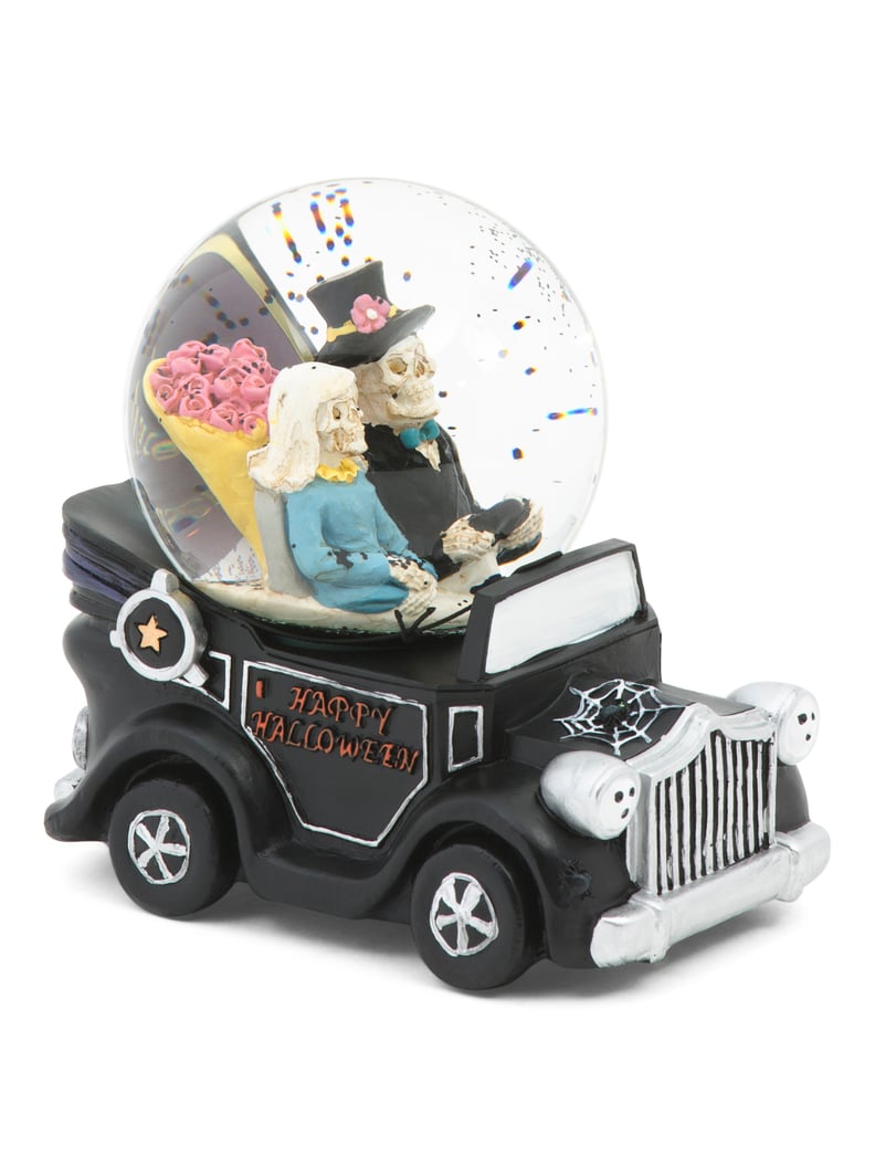 Skeleton Driving a Car Globe With Music