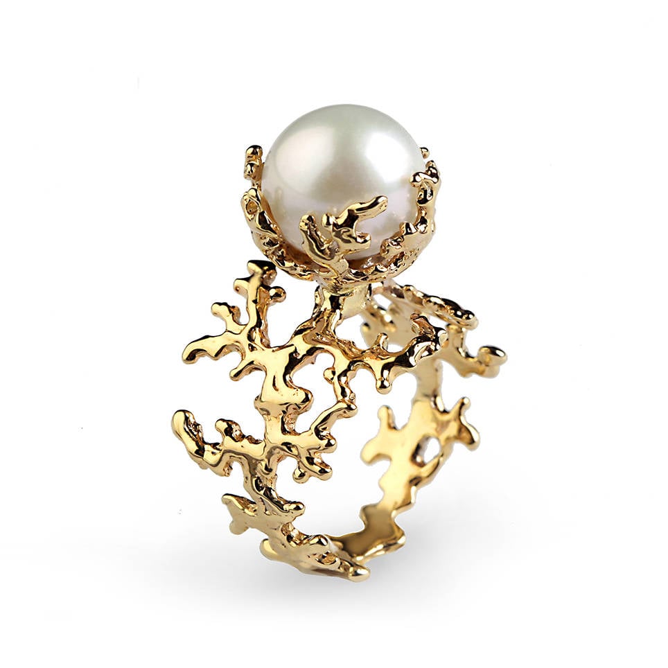 This ring's band was inspired by the living sculptures of coral ($1,210) and features a round white pearl.
This ring's band was inspired by the living sculptures of coral ($1,210) and features a round white pearl.