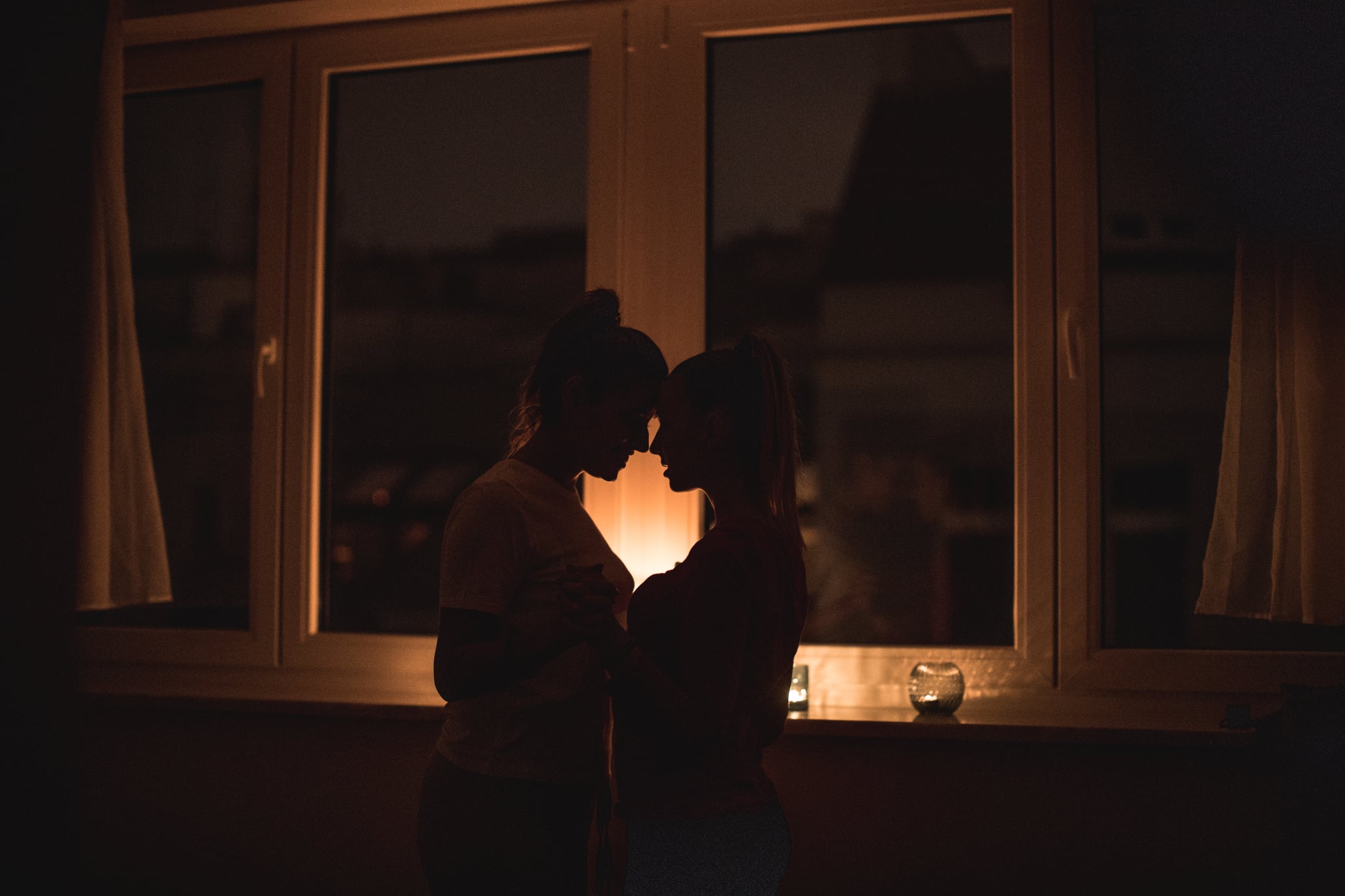 Lesbian couple, romantic night with candles