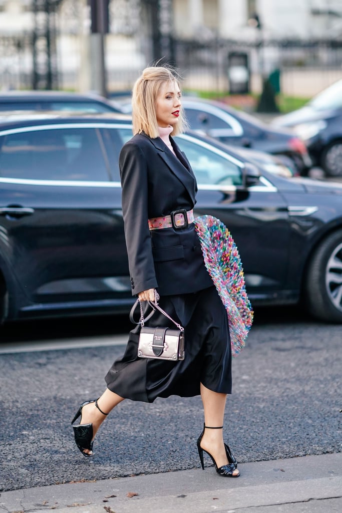 There's nothing like a multicolored belt to bring a black blazer to life.