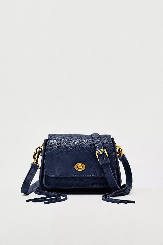 By Anthropologie Porter Leather Mini Bag ($128)
Fall signals the return of all our favorite autumn-coded activities such as football games and pumpkin picking. What do these things have in common? The need for a great mini purse. Made of 100 percent genuine full-grain leather, this crossbody will hold all your essentials secured with a gold turn lock clasp. Bonus points for the adorable tassel details on each side.