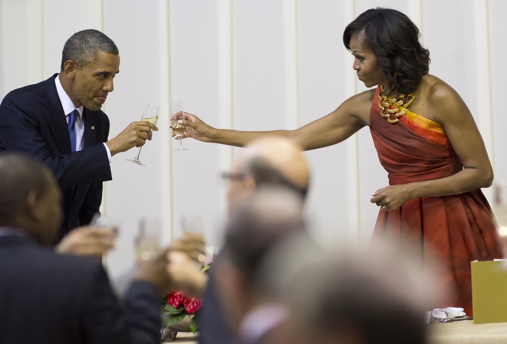 President Obama and First Lady Michelle clinked their glasses together while visiting Pretoria, South Africa, in June 2013.