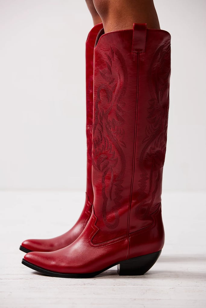 Jeffrey Campbell Finn Tall Western Boots ($368)
The Western aesthetic will always be a festival staple. You'll want a trusty pair of cowboy boots to take you through festival season, and we love the classic details of this tall Jeffrey Campbell silhouette, which is also available in silver crackle, washed black, gray, light blue metallic, and dark blue. They're a top-rated style at Free People, so shop them quickly before they sell out.