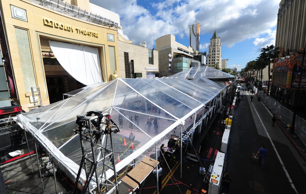 The plastic roof over the red carpet stood tall amid a break from the rain on Thursday.