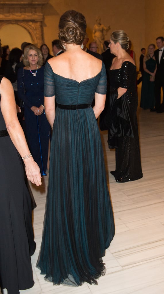 And Gave Us a View of the Back of Her Gown