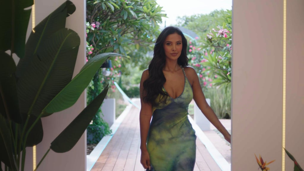 During the launch episode, Jama joined the winter "Love Island" 2023 cast to get the flirting started, and her entrance outfits did not disappoint. Wearing a plunging tie-dye printed maxi dress with ruffles at the hem and a studded halterneck, her outfit was perfectly pitched for the occasion. Sexy, yet sophisticated, the Roberto Cavalli dress is from the resort 2023 collection, so not currently available to buy. Her hair was kept down with soft waves as she sported winged eyeliner and a nude lip setting the tone for the highly anticipated series.