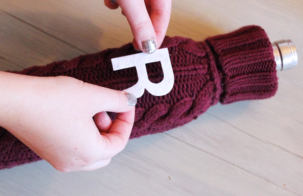If you don't have sticky letters, you can always trace and cut out your own letter and hot glue it to the sleeve as well.
